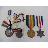 A WWI war medal awarded to Pte. J.W.Stevens A.S.C., no. S-362034, plus various other medals