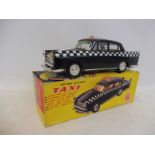 A boxed battery operated Morris Oxford Taxi, by OK, made in Hong Kong.