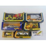 Seven boxed Corgi vehicles.