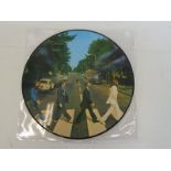 A contemporary Beatles Abbey Road picture disc.