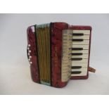 A small Hohner piano accordion.
