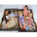 Two boxes of assorted dolls, clothing etc.