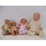 Four early composite 'baby' dolls.