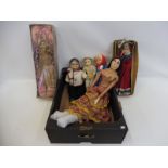 Two early wax dolls, a wooden ventriloquist's puppet and three others, two in rice paper costumes,