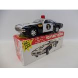 A boxed Japanese tinplate battery operated High Way Patrol 'Non-Fall Mystery Bump N Go', by repute