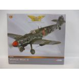 A Corgi Aviation Archive 1/32 scale 'Attack by Night' Messerschmitt 109G, red 6, appears in