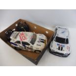 A Thunder Tiger Ford Escort Cosworth 1/10 scale nitro touring remote controlled car and a Kyosho