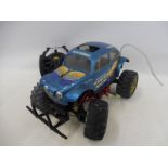 A Tamiya hump backed VW Monster Beetle, 4WD battery operated plus controller.