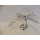 A contemporary stylish polished aluminium model aeroplane on stand plus a clear glass model of a