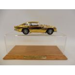 A Danbury Mint James Bond 007 24ct gold plated DB5 handcrafted from over 300 individual parts, the