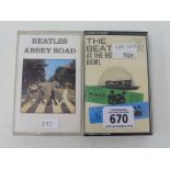 Two hard-to-find Beatles cassette tapes: Hollywood Bowl and Abbey Road, unchecked.