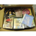 Three boxes containing hundreds of CDs featuring Rock, Pop and many other genres, unchecked.
