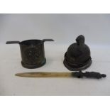 A Trench Art brass pot bearing RAF badge to the front, an inkwell in the form of a fireman's