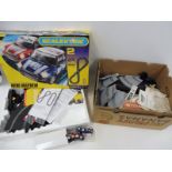 A quantity of Scalextric to include two Mini Coopers, an Advanced Track System etc.