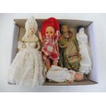 A small box of miniature dolls including porcelain and composite.