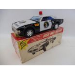 A boxed Japanese tinplate battery operated High Way Patrol 'Non-Fall Mystery Bump N Go', by repute