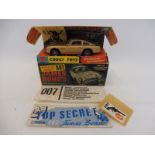 A 1965 Corgi 261 James Bond 007 Aston Martin DB5 in its original inner and outer box with opened