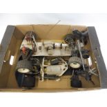 A box of early aluminium remote controlled car chassis' including a Formula 1 chassis with a Super