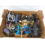 A Thunder Tiger 2WD nitro rolling chassis and a 4WD rolling nitro chassis plus various accessories.