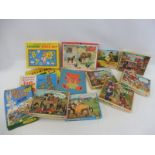 A collection of early jigsaw puzzles many tv related including Camberwick Green, The Magic