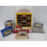 A group of mixed boxed die-cast models plus a boxed wall mounted model shelf.