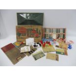 A boxed Mettoy 'Metal Dolls House' and garage with a tray of period dolls house furniture with