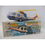 A boxed Japanese tinplate battery powered Super Flying Police Helicopter, by repute in good