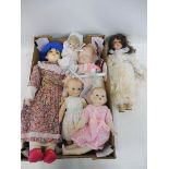 A box of mostly contemporary porcelain headed dolls.