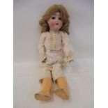 A Max Handwerck German bisque headed doll with open mouth and moving eyes, composite limbs and