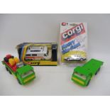 Two loose Matchbox K-13 DAF trucks with original accessories, a carded and sealed Corgi Juniors
