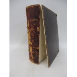 A leather bound photograph album 'Northampton', including scenes of motor cars, cycling and