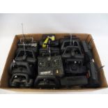 A box of 17 remote controlled car controllers.