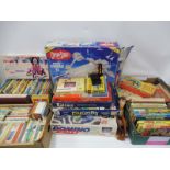 A quantity of childrens games, toys and books to include Enid Blyton, Captain Scarlett etc.