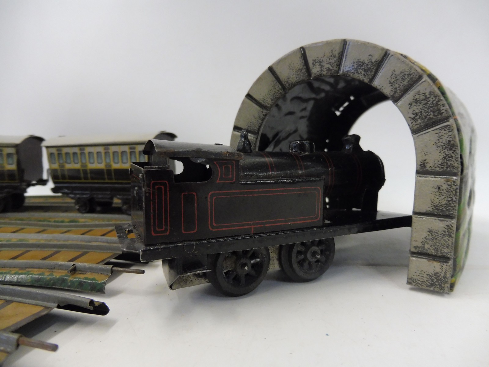 A German tinplate clockwork part train set, possibly Bing comprising a locomotive, two carriages, - Image 5 of 5