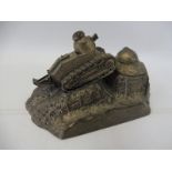 A WWI Trench Art French inkwell in the form of a tank on a stylised base, stamped underneath.