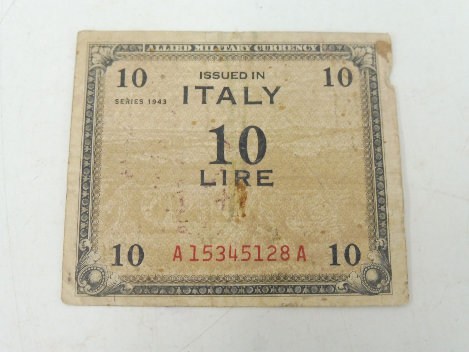 A WWII Allied bank note, an Italian 10 Lire the verso bearing the signatures for Flanagan & Allen of