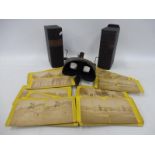 Two cases of stereoscopic slides titled 'The Japanese Russian War Through The Stereoscope', plus a