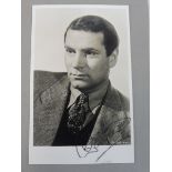 An album of autographed photographs of film stars including Dirk Bogarde, Laurence Olivier, Flora