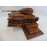 A well made wooden scale model of a German WWII tank on stand.