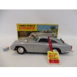 A 1965 Gilbert James Bond 007 tinplate Aston Martin DB5 - a rare find in this condition. Produced in