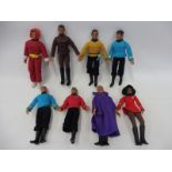 Seven Mego figures, from the 1960s, six Star Trek, one Space 1999, all uniforms with badges, some