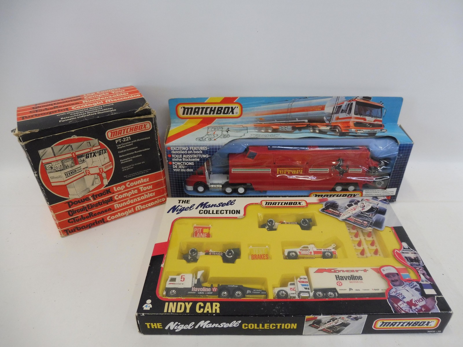 Three boxed Matchbox die-cast model sets to include The Nigel Mansell Collection Indy car set.