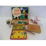 A selection of games including Blow Football, a tinplate aeroplane etc.