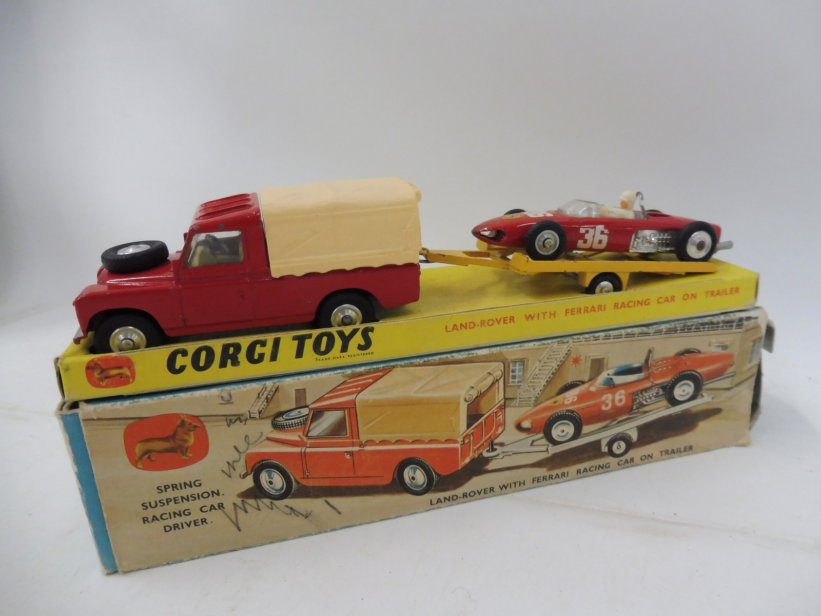 A Corgi Land Rover with Ferrari Gift Set 17. First issued in 1963, the set includes a Land Rover