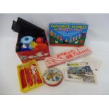 A box of assorted toys to include Keilkraft Polaris, boxed rollerskates, kitchen utensils etc.