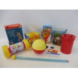 A group of early toys, some by rare British manufacturers including a boxed Fisher Price Melody Push