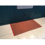 A 1950s woven plastic kitchen floor mat, a rare surviving retro interior piece.