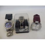 Three designer watches including Umbro and Guess, all with new batteries.