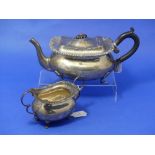 A George V silver Teapot, by Goldsmiths & Silversmiths Co., hallmarked London, 1913, of ovoid form