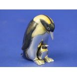 A Saturno contemporary sterling silver and enamel Penguin with Chick, hallmarked London 2009, 5.